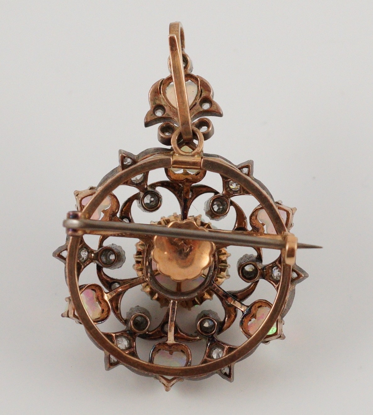 A late Victorian gold silver and diamond circular cluster pendant brooch, 3.5cm, gross 17.5 grams